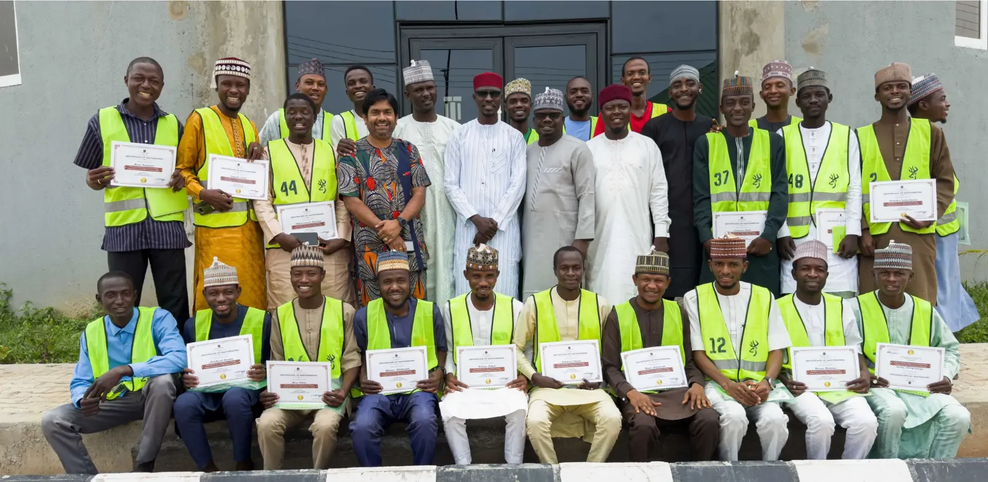 TMDK Agro Park team members in high-visibility vests with certificates