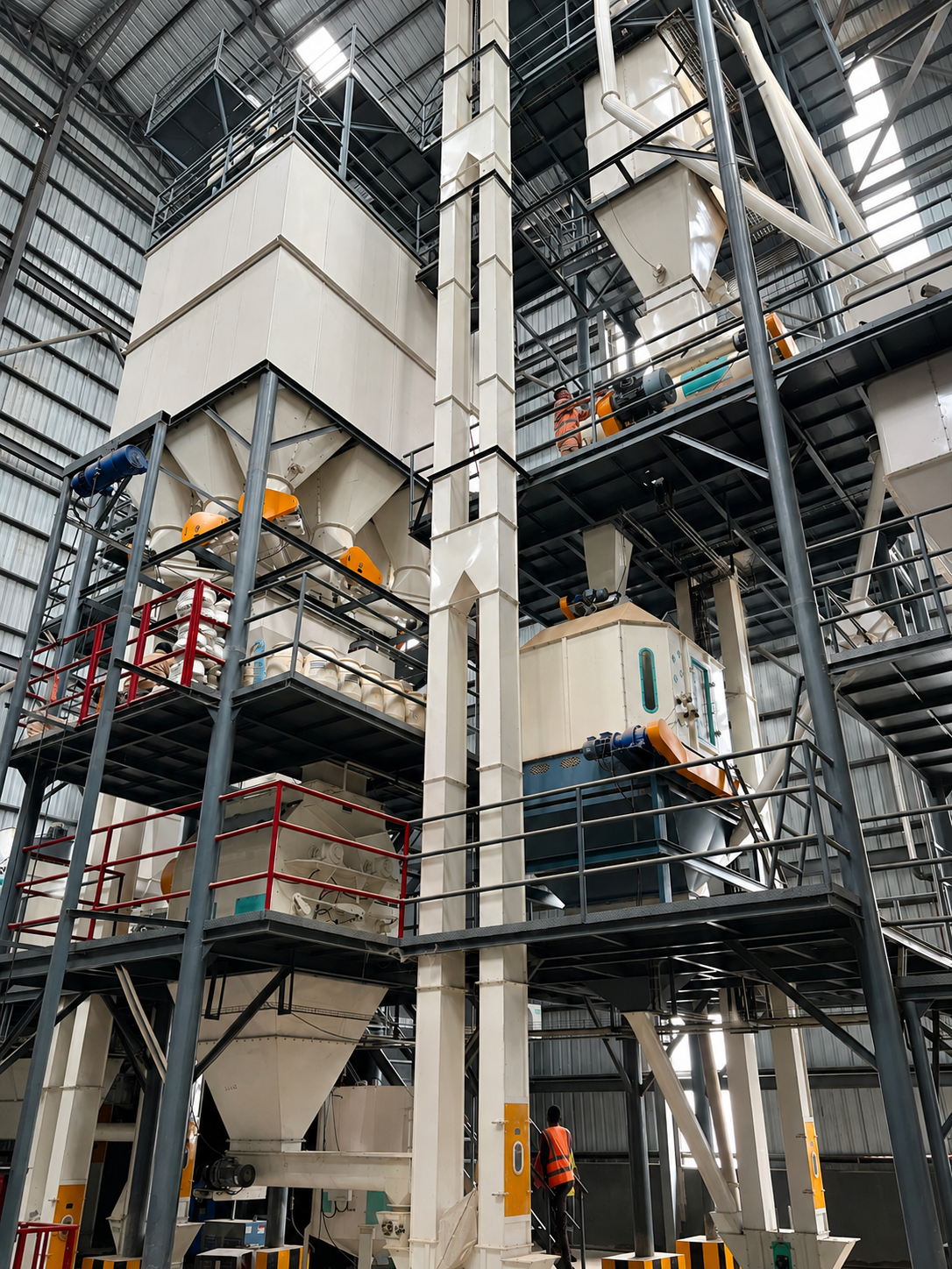 TMDK feed mill interior with mixing and pelleting equipment