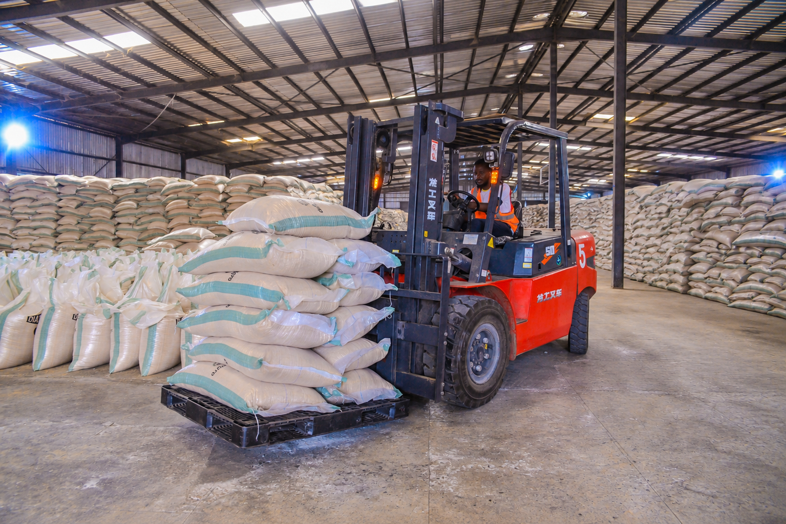 Forklift moving bagged product in the TMDK warehouse