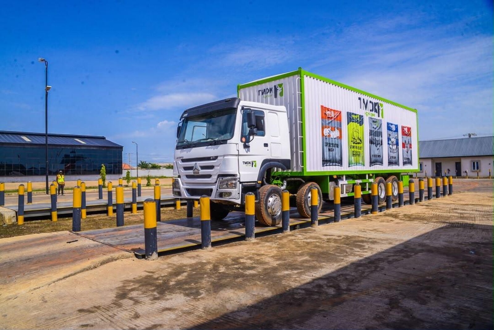 A branded TMDK Agro Park delivery truck on the weighbridge